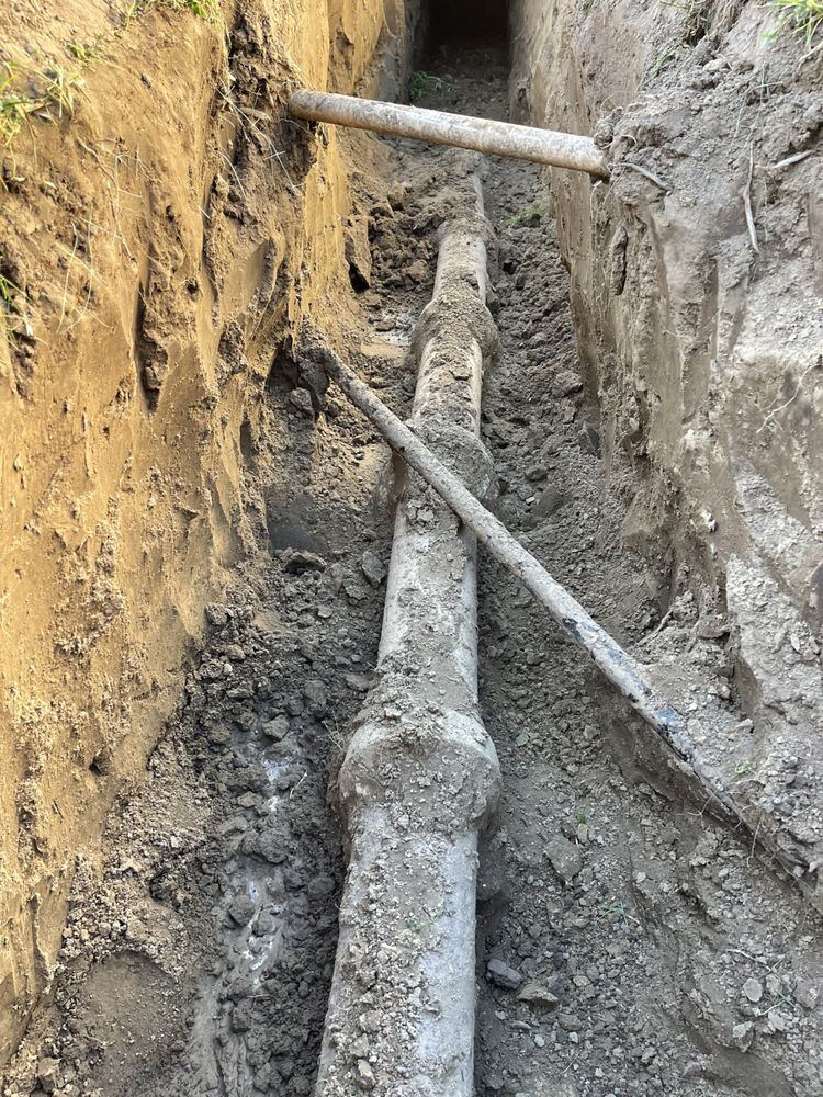 Buried line exposed in an open trench